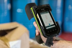 Warehouse worker uses Zebra Handheld Inventory Scanner